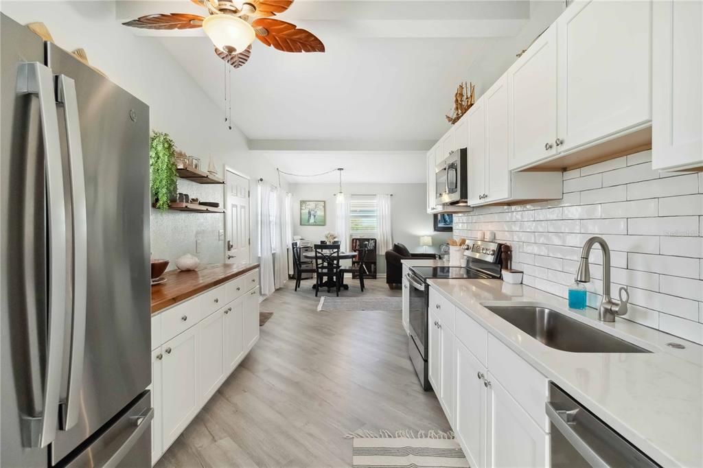 Dining room, Interior, Kitchen, Pendant Lights, Stainless Steel Appliances, Wood Texture Flooring