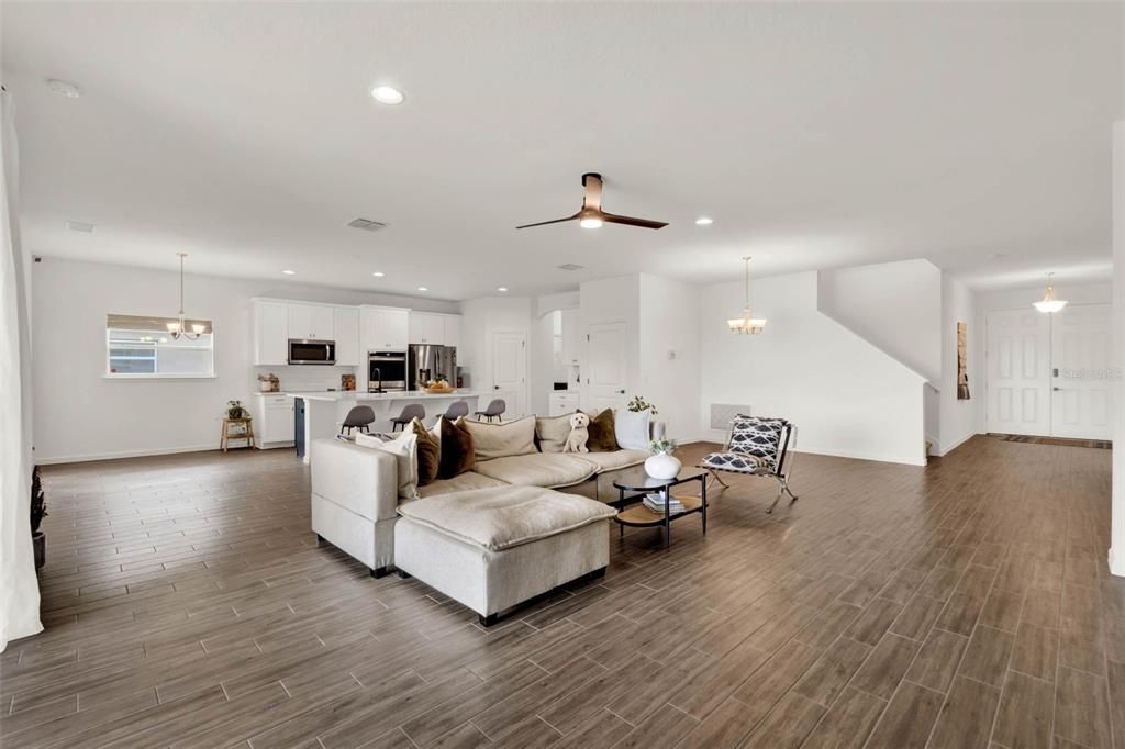 Chandelier, Interior, Kitchen, Living room, Pendant Lights, Recessed Lighting, Stainless Steel Appliances, Wood Texture Flooring