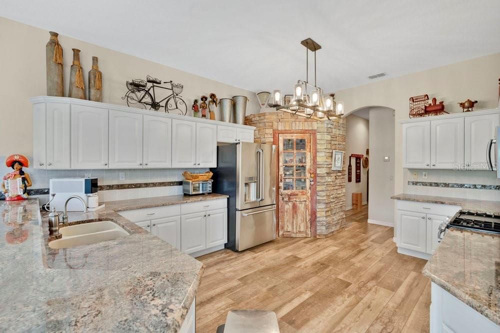 Interior, Kitchen, Pendant Lights, Stainless Steel Appliances, Stone Walls, Wood Texture Flooring