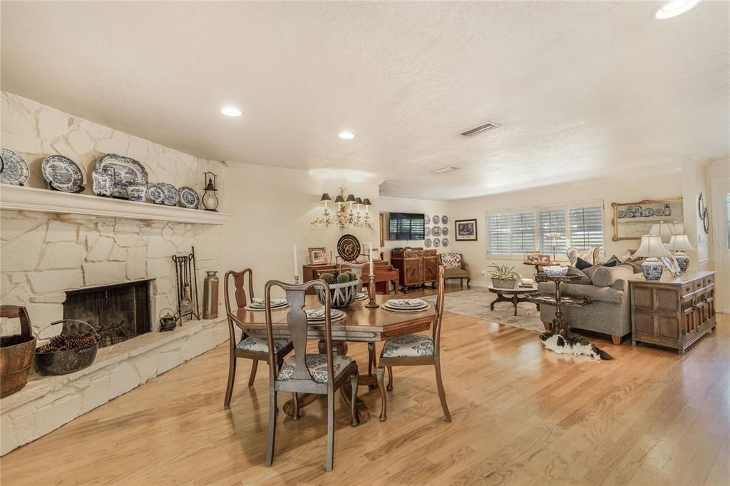 Dining room, Fireplace, Interior, Living room, Recessed Lighting, Wood Texture Flooring