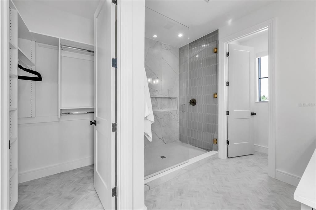 Bathroom, Glass Shower, Interior, Marble, Marble Walls, Recessed Lighting, Walk-in Closets, Wood Texture Flooring