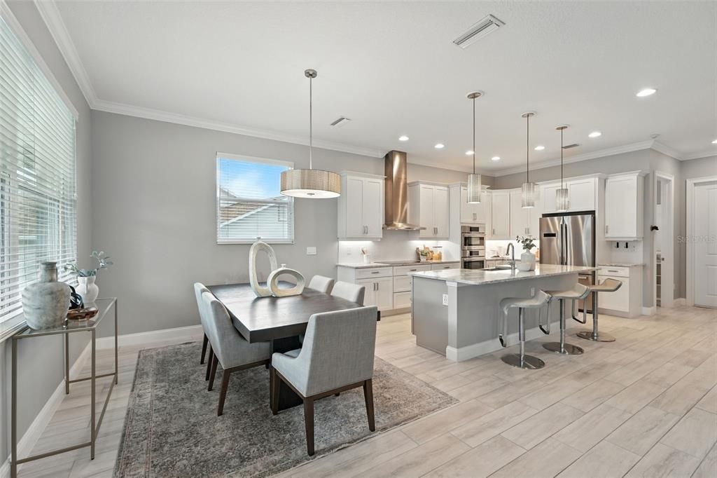 Dining room, Interior, Kitchen, Pendant Lights, Recessed Lighting, Stainless Steel Appliances, Wood Texture Flooring