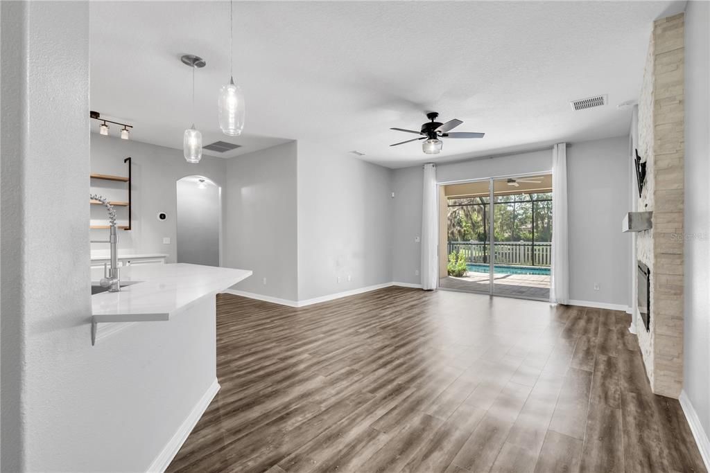 Empty room, Fireplace, Interior, Pendant Lights, Wood Texture Flooring