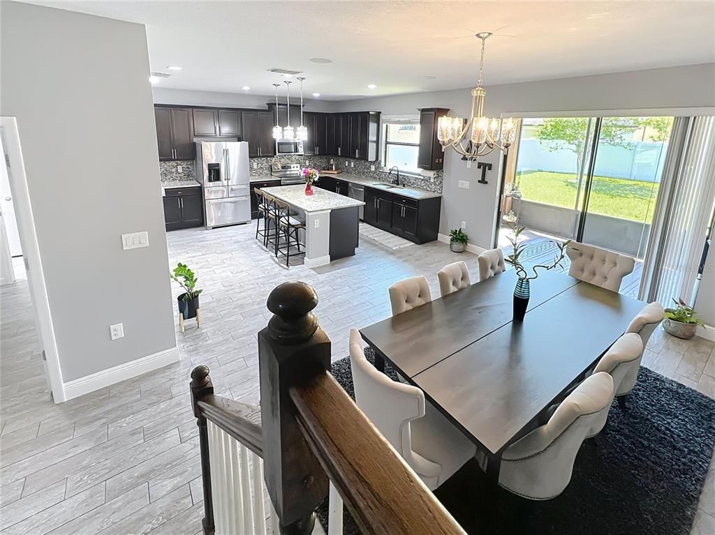 Chandelier, Dining room, Interior, Kitchen, Pendant Lights, Recessed Lighting, Stainless Steel Appliances, Wood Texture Flooring