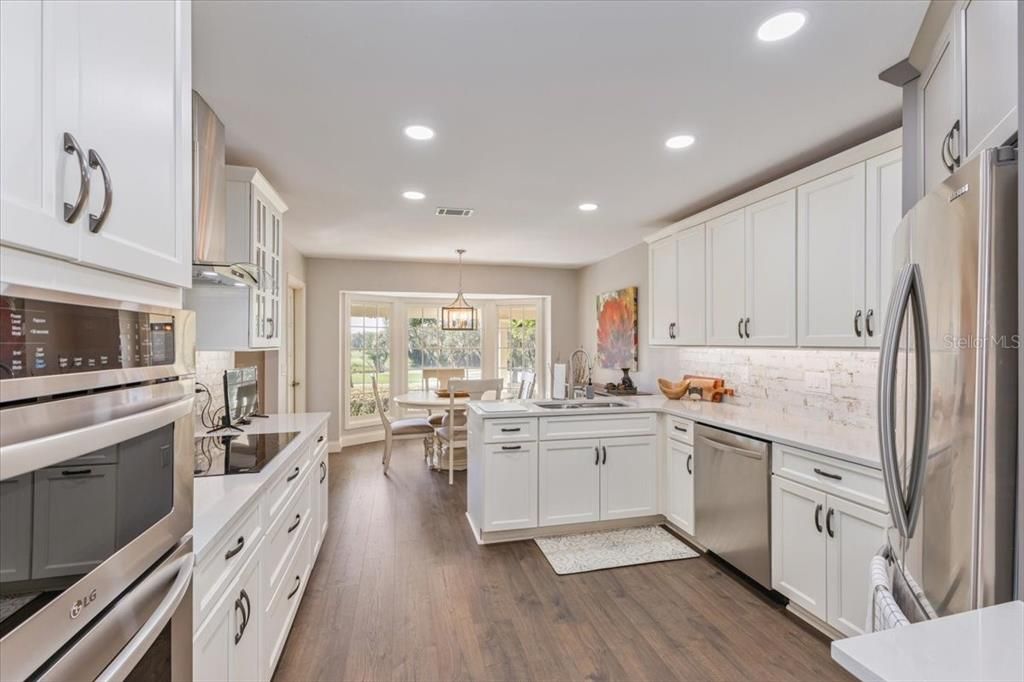 Dining room, Interior, Kitchen, Pendant Lights, Recessed Lighting, Stainless Steel Appliances, Wood Texture Flooring