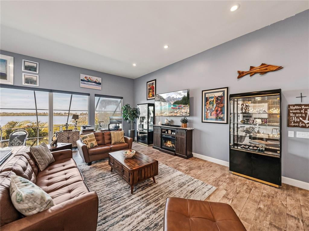 Fireplace, Interior, Living room, Recessed Lighting, Water, Wood Texture Flooring