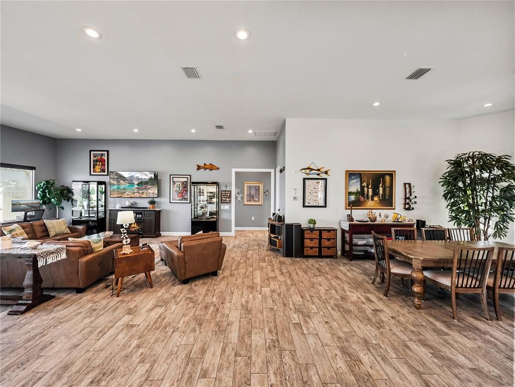 Dining room, Fireplace, Interior, Living room, Recessed Lighting, Wood Texture Flooring