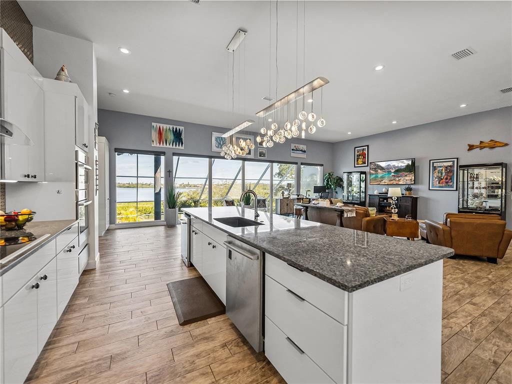 Dining room, Interior, Kitchen, Living room, Pendant Lights, Recessed Lighting, Stainless Steel Appliances, Wood Texture Flooring