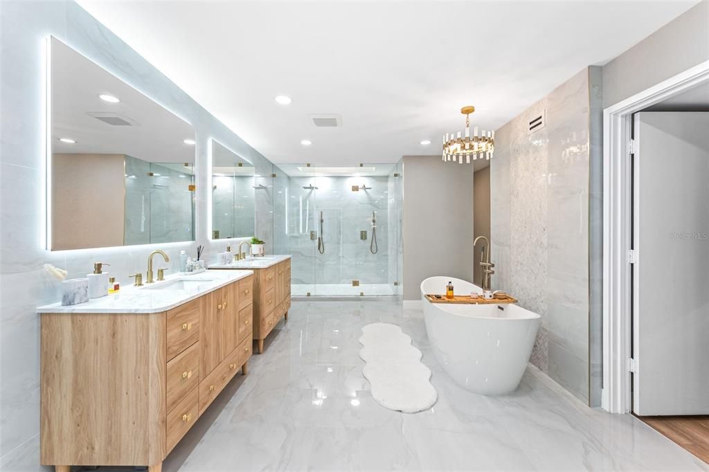 Bathroom, Chandelier, Dual Sink Vanities, Free Standing Baths, Glass Shower, Interior, Marble, Marble Walls, Recessed Lighting