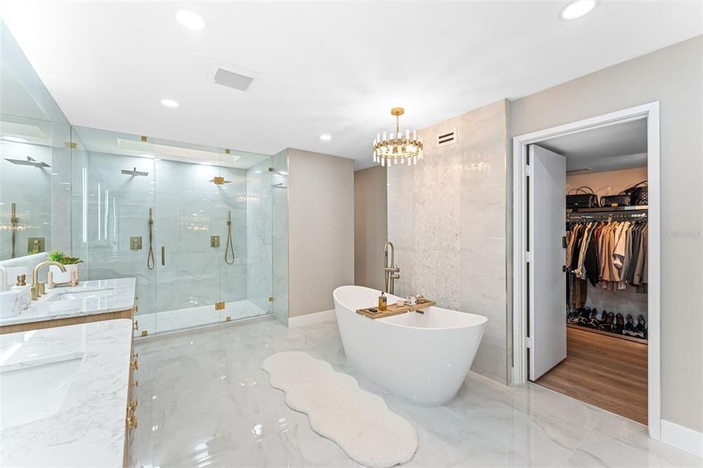 Bathroom, Chandelier, Dual Sink Vanities, Free Standing Baths, Glass Shower, Interior, Marble, Marble Walls, Recessed Lighting, Walk-in Closets, Wood Texture Flooring