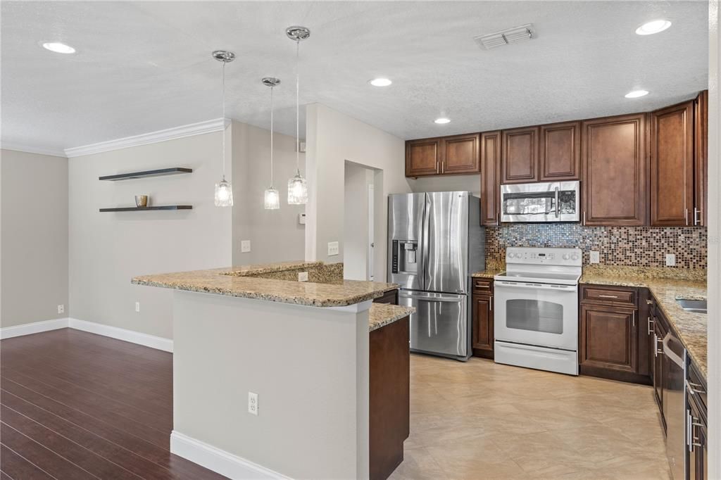 Interior, Kitchen, Pendant Lights, Recessed Lighting, Stainless Steel Appliances, Wood Texture Flooring