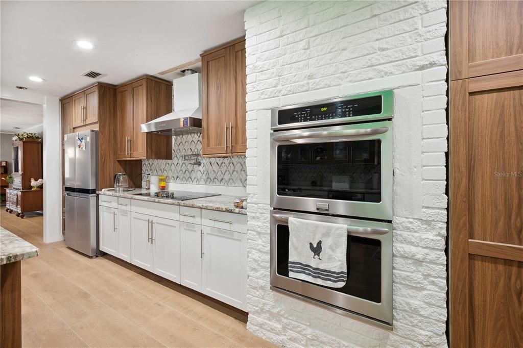 Interior, Kitchen, Recessed Lighting, Stainless Steel Appliances, Stone Walls, Wood Texture Flooring