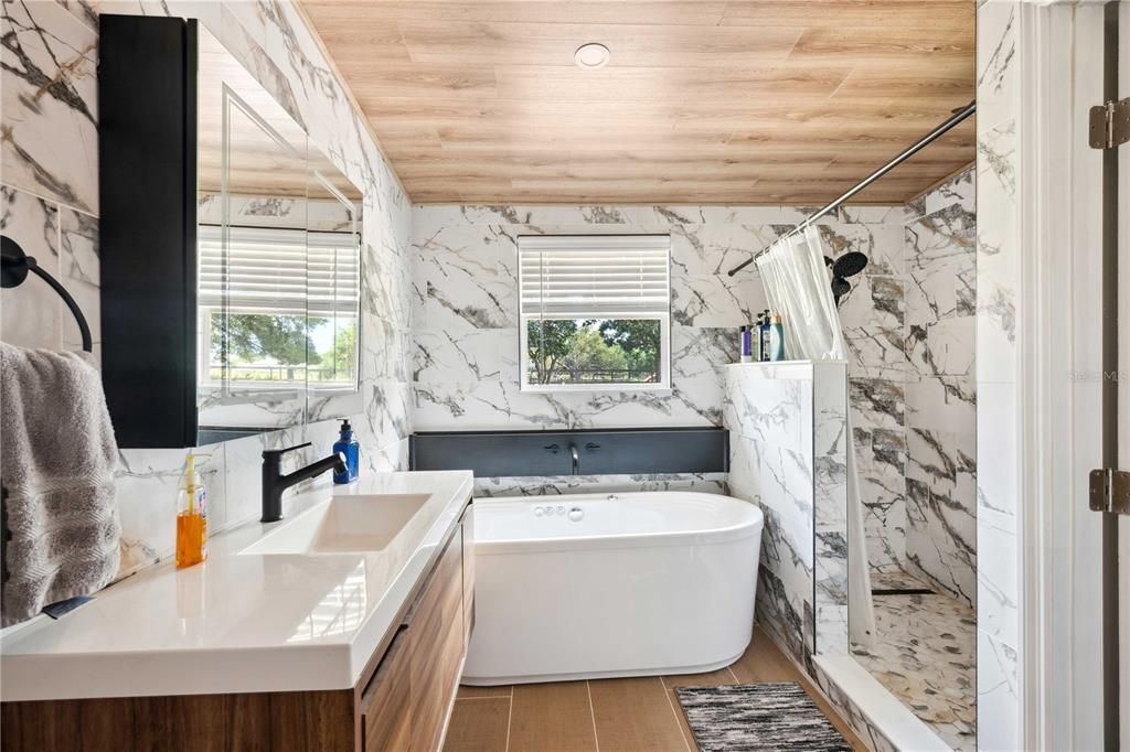 Bathroom, Dual Sink Vanities, Free Standing Baths, Interior, Marble Walls, Recessed Lighting, Wooden Ceilings, Wood Texture Flooring