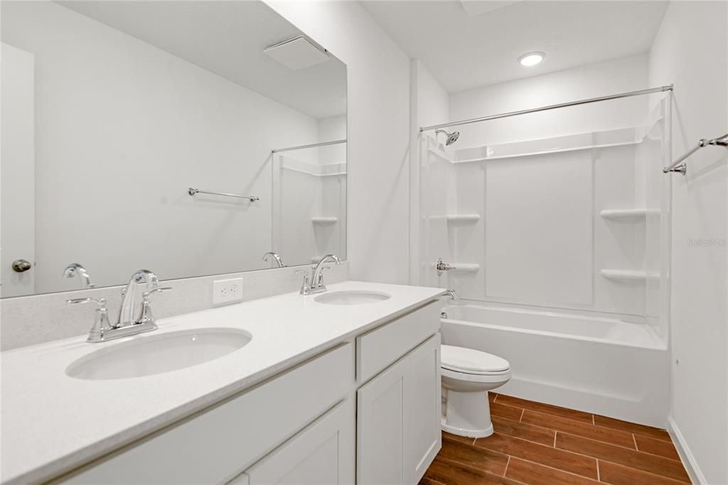 Bathroom, Dual Sink Vanities, Interior, Recessed Lighting, Walk-in Closets, Wood Texture Flooring