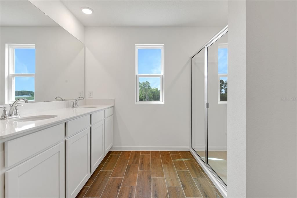 Bathroom, Dual Sink Vanities, Glass Shower, Interior, Recessed Lighting, Wood Texture Flooring
