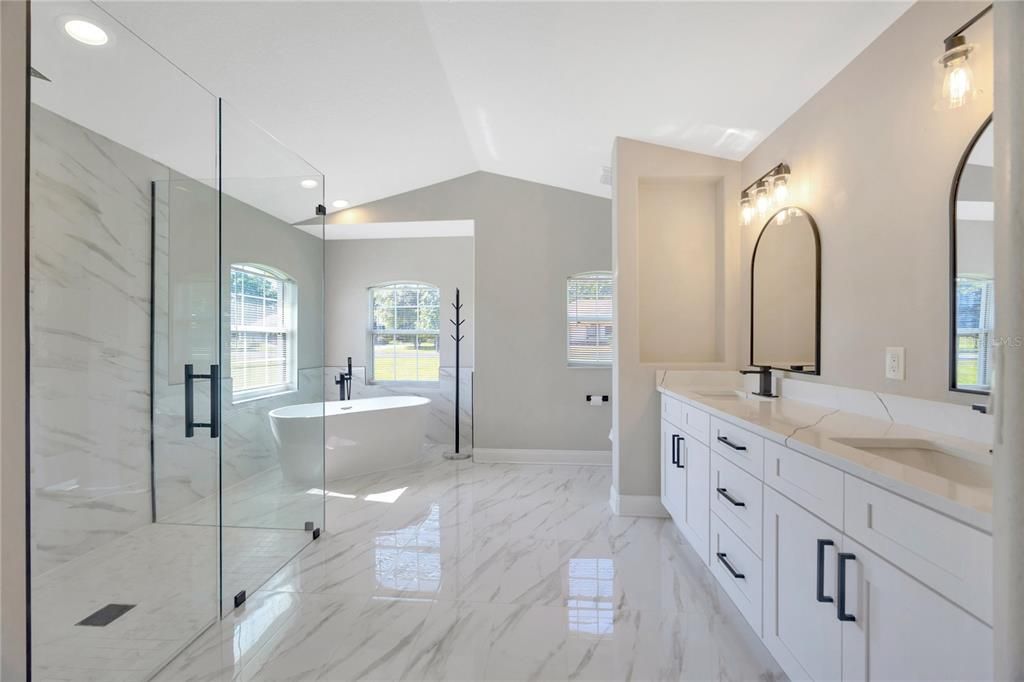 Bathroom, Dual Sink Vanities, Free Standing Baths, Glass Shower, Interior, Marble, Marble Walls, Recessed Lighting