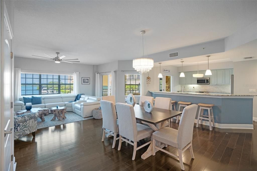 Chandelier, Dining room, Interior, Kitchen, Living room, Pendant Lights, Stainless Steel Appliances, Wood Texture Flooring