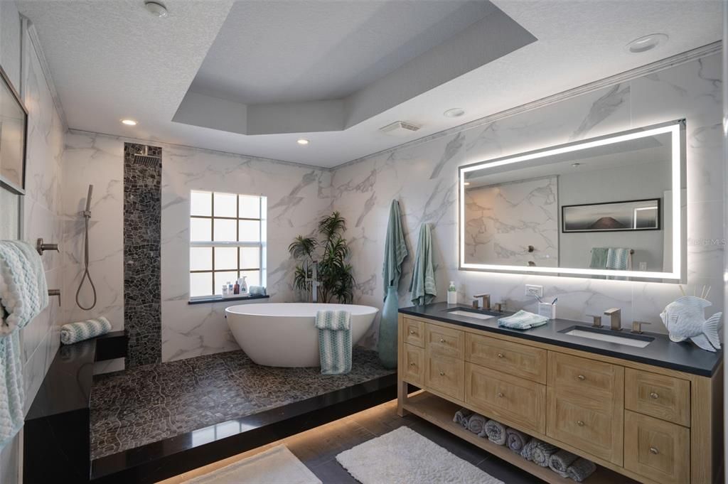 Bathroom, Dual Sink Vanities, Free Standing Baths, Interior, Marble Walls, Recessed Lighting, Wood Texture Flooring