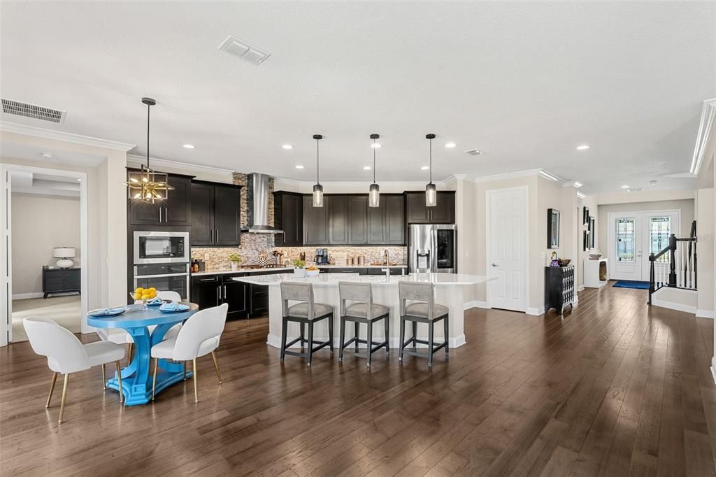 Dining room, Interior, Kitchen, Pendant Lights, Recessed Lighting, Stainless Steel Appliances, Wood Texture Flooring