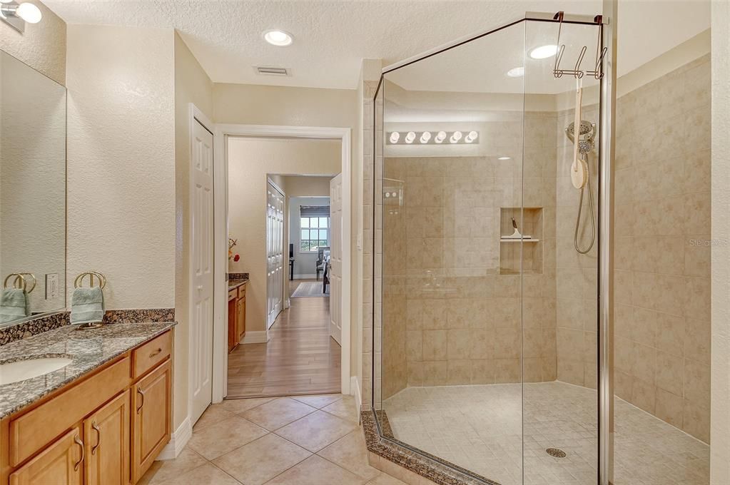 Bathroom, Dual Sink Vanities, Glass Shower, Interior, Recessed Lighting, Wood Texture Flooring