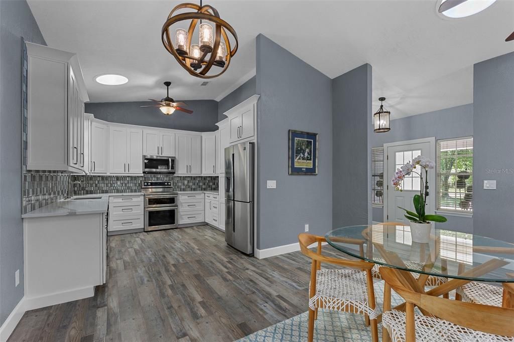 Dining room, Interior, Kitchen, Pendant Lights, Stainless Steel Appliances, Wood Texture Flooring