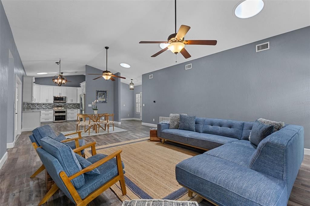 Dining room, Interior, Kitchen, Living room, Recessed Lighting, Stainless Steel Appliances, Wood Texture Flooring