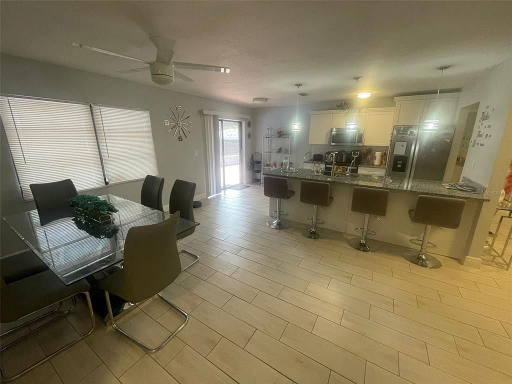 Dining room, Interior, Kitchen, Pendant Lights, Stainless Steel Appliances, Wood Texture Flooring
