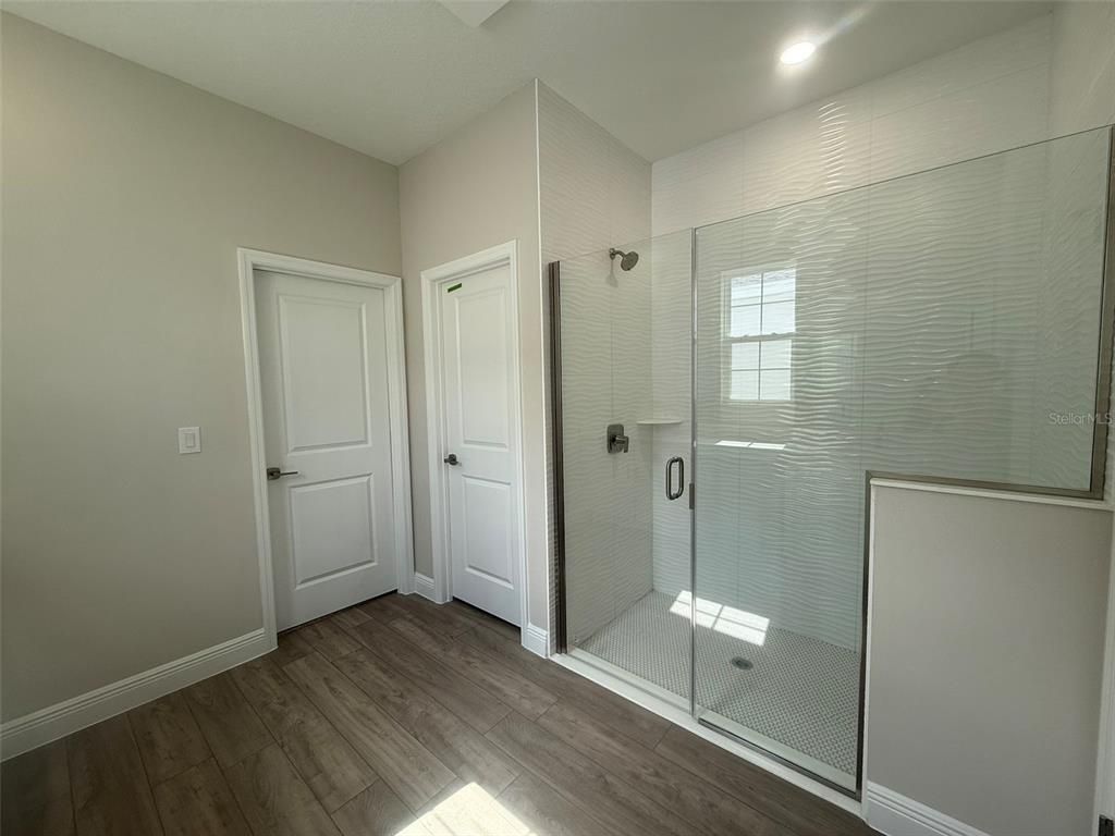 Bathroom, Glass Shower, Interior, Recessed Lighting, Wood Texture Flooring