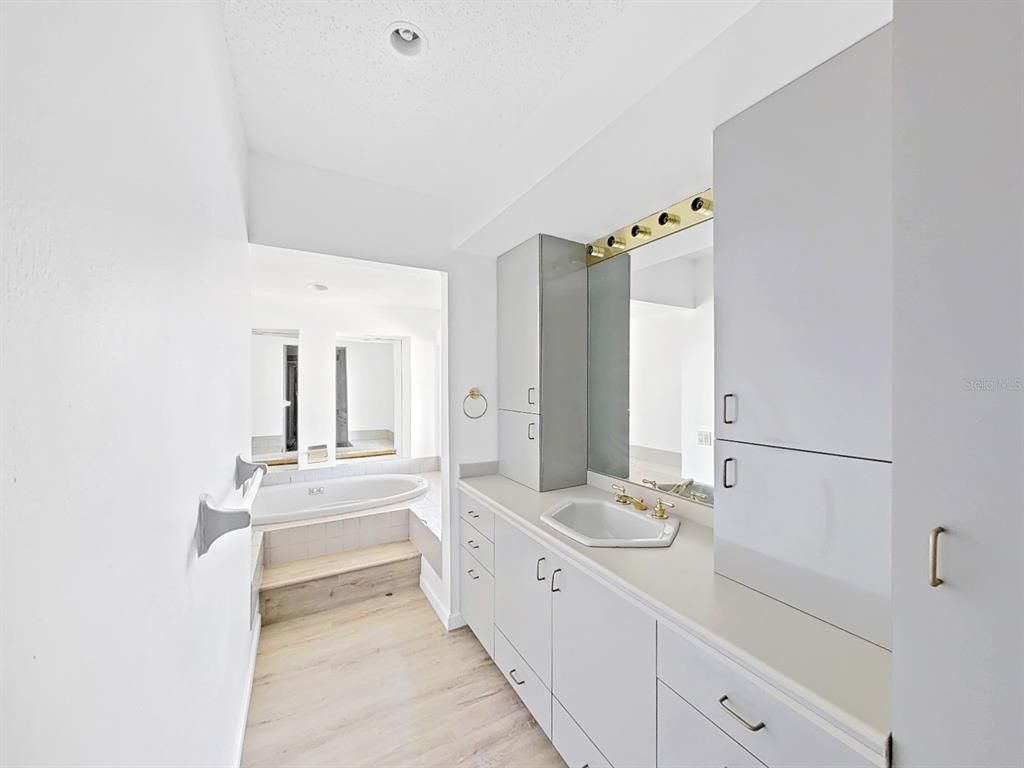 Bathroom, Dual Sink Vanities, Interior, Recessed Lighting, Wood Texture Flooring