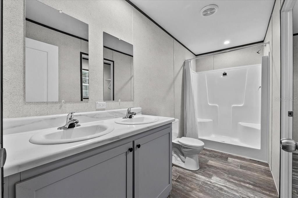 Bathroom, Dual Sink Vanities, Interior, Recessed Lighting, Wood Texture Flooring