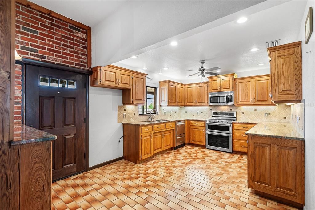 Interior, Kitchen, Recessed Lighting, Stainless Steel Appliances, Stone Walls