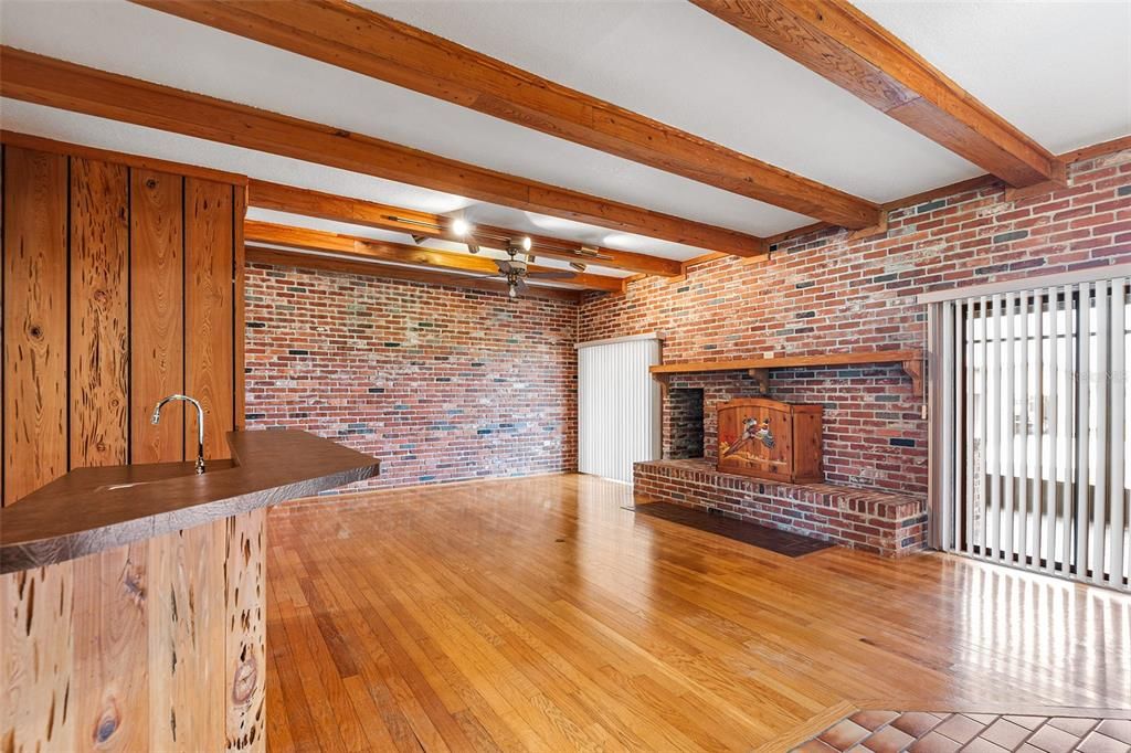 Empty room, Fireplace, Interior, Stone Walls, Wooden Beams, Wood Texture Flooring