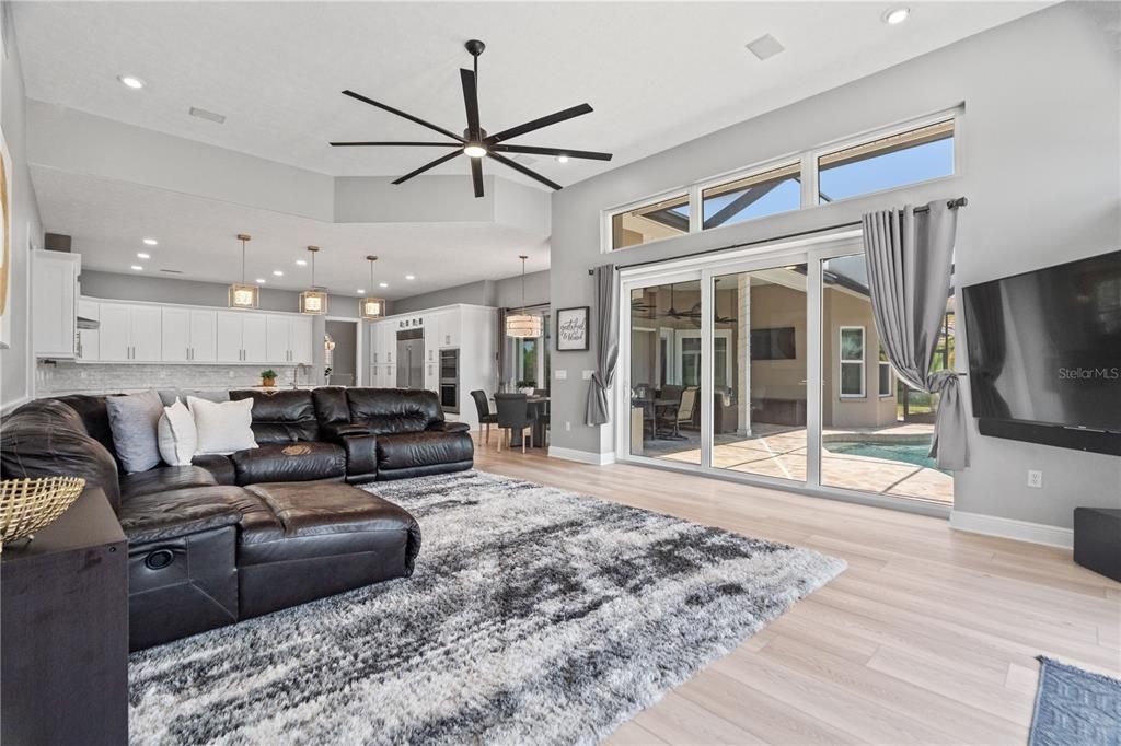 Dining room, Interior, Kitchen, Living room, Pendant Lights, Recessed Lighting, Stainless Steel Appliances, Wood Texture Flooring