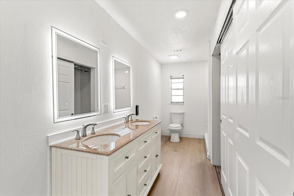 Bathroom, Dual Sink Vanities, Interior, Recessed Lighting, Wood Texture Flooring