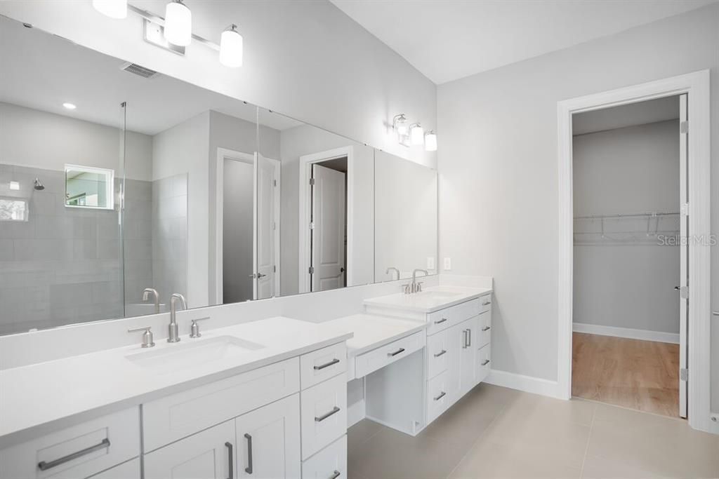 Bathroom, Dual Sink Vanities, Glass Shower, Interior, Recessed Lighting, Walk-in Closets, Wood Texture Flooring
