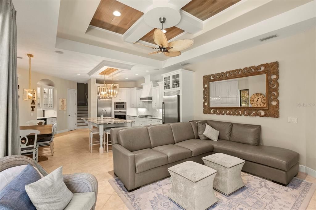 Chandelier, Dining room, Interior, Kitchen, Living room, Pendant Lights, Recessed Lighting, Stainless Steel Appliances, Wooden Ceilings