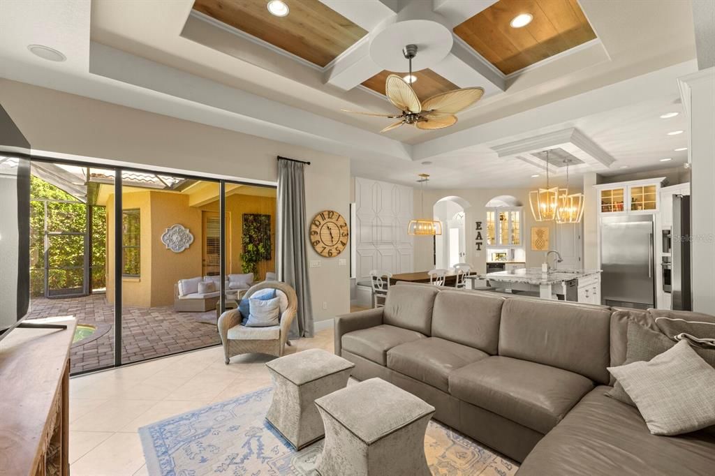 Chandelier, Dining room, Interior, Kitchen, Living room, Pendant Lights, Recessed Lighting, Stainless Steel Appliances, Wooden Ceilings