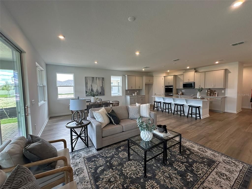 Dining room, Interior, Kitchen, Living room, Recessed Lighting, Stainless Steel Appliances, Wood Texture Flooring