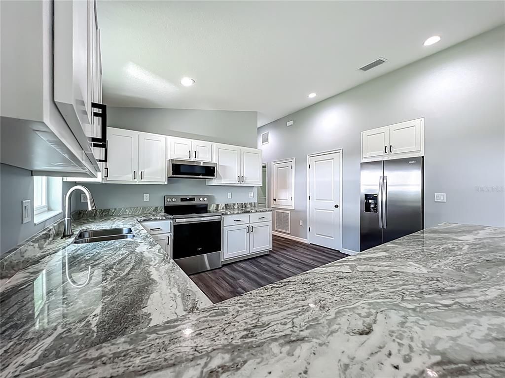 Interior, Kitchen, Recessed Lighting, Stainless Steel Appliances, Wood Texture Flooring