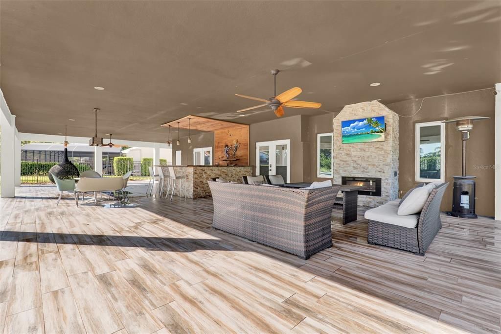 Exterior, Fireplace, Living room, Recessed Lighting, Wood Texture Flooring