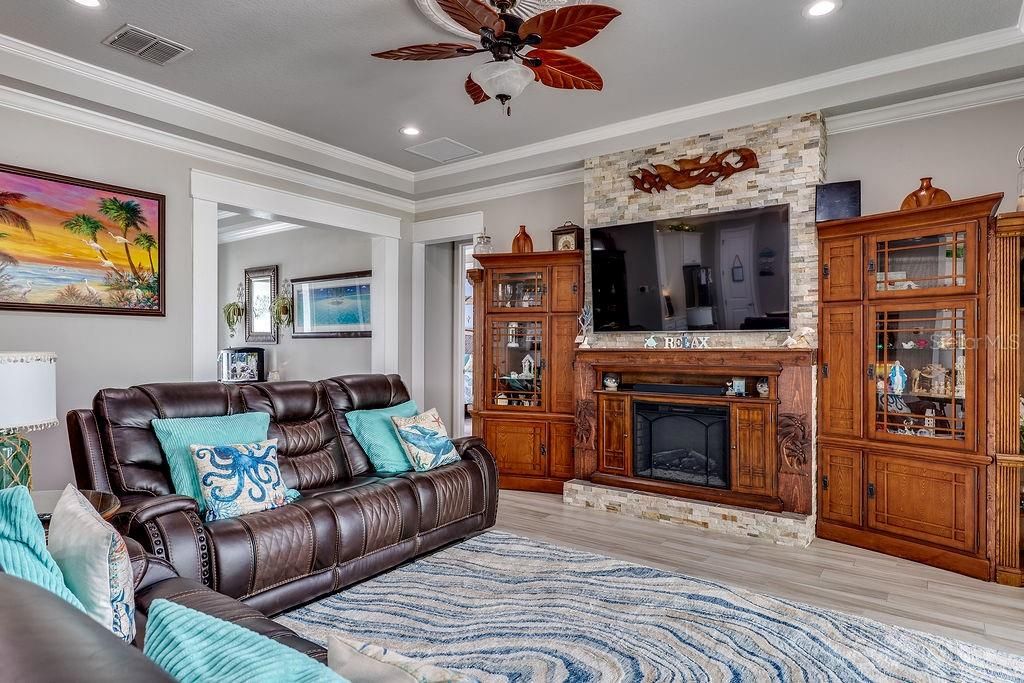 Fireplace, Interior, Living room, Recessed Lighting, Stone Walls, Wood Texture Flooring