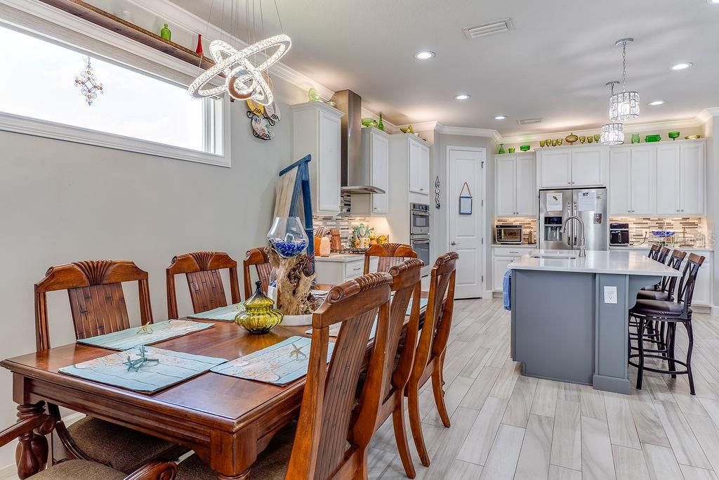Dining room, Interior, Kitchen, Pendant Lights, Recessed Lighting, Stainless Steel Appliances, Wood Texture Flooring
