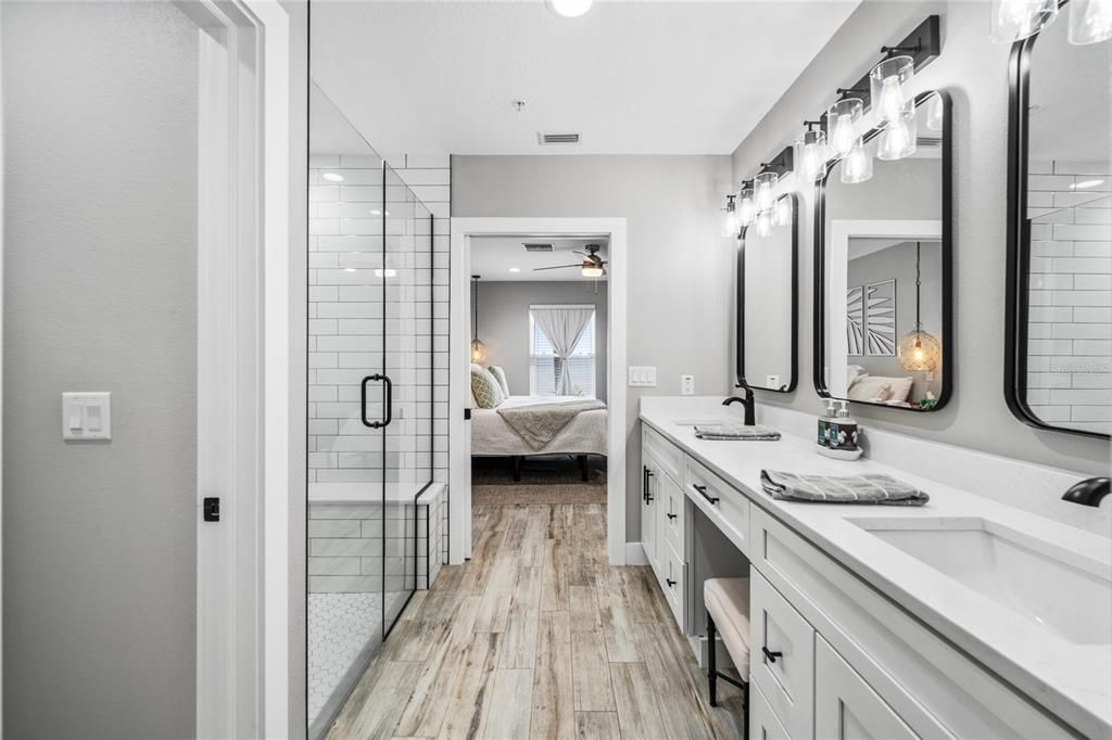 Bathroom, Bedroom, Dual Sink Vanities, Glass Shower, Interior, Recessed Lighting, Wood Texture Flooring