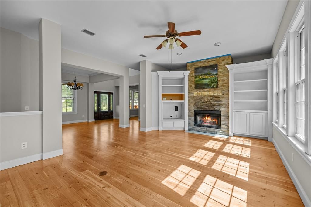 Chandelier, Empty room, Fireplace, Interior, Stone Walls, Wood Texture Flooring