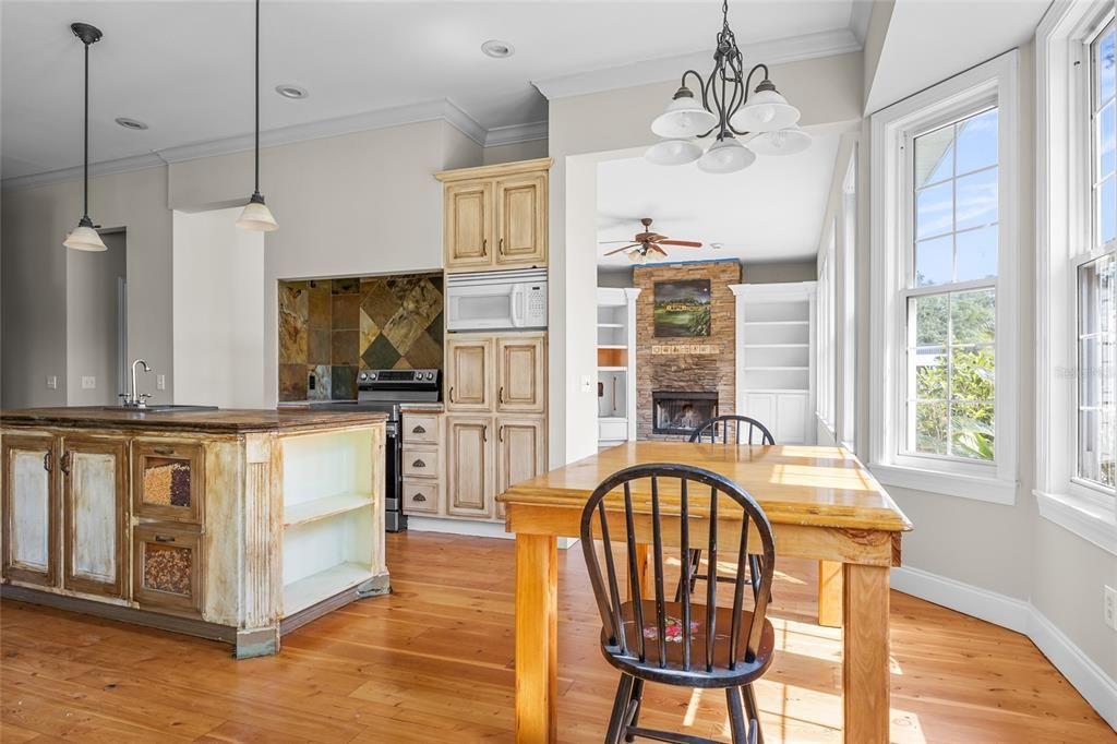 Dining room, Fireplace, Interior, Kitchen, Pendant Lights, Recessed Lighting, Wood Texture Flooring