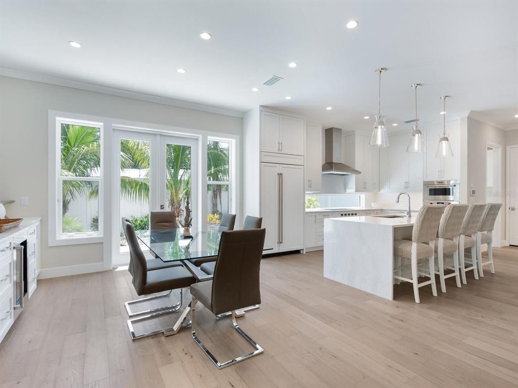 Dining room, Interior, Kitchen, Pendant Lights, Recessed Lighting, Stainless Steel Appliances, Wood Texture Flooring