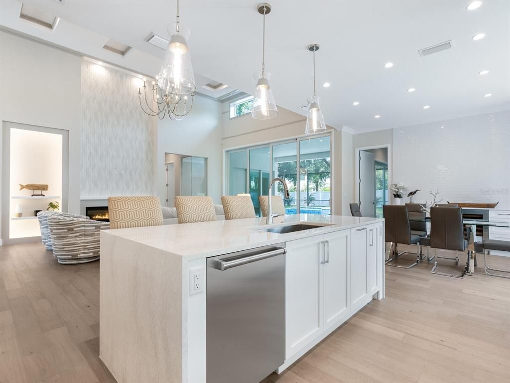 Dining room, Fireplace, Interior, Kitchen, Pendant Lights, Recessed Lighting, Stainless Steel Appliances, Wood Texture Flooring