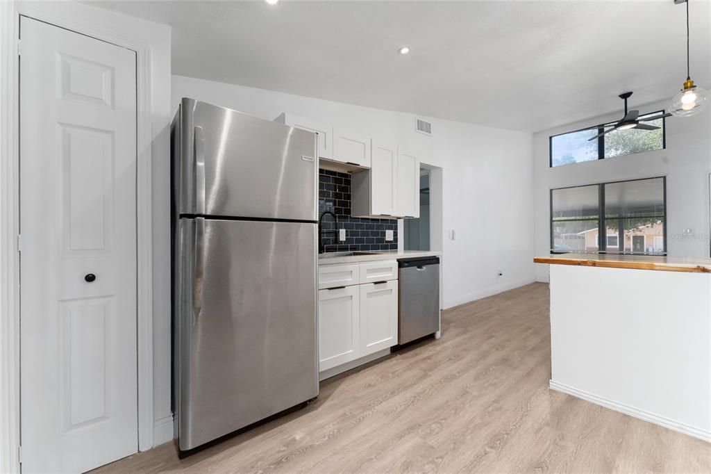 Interior, Kitchen, Pendant Lights, Recessed Lighting, Stainless Steel Appliances, Wood Texture Flooring