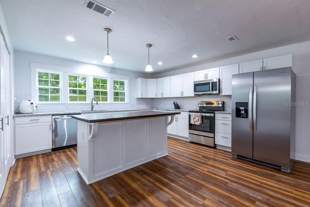 Interior, Kitchen, Pendant Lights, Recessed Lighting, Stainless Steel Appliances, Wood Texture Flooring