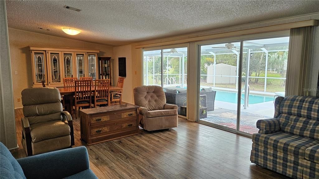 Dining room, Interior, Pool, Sun Room, Wood Texture Flooring